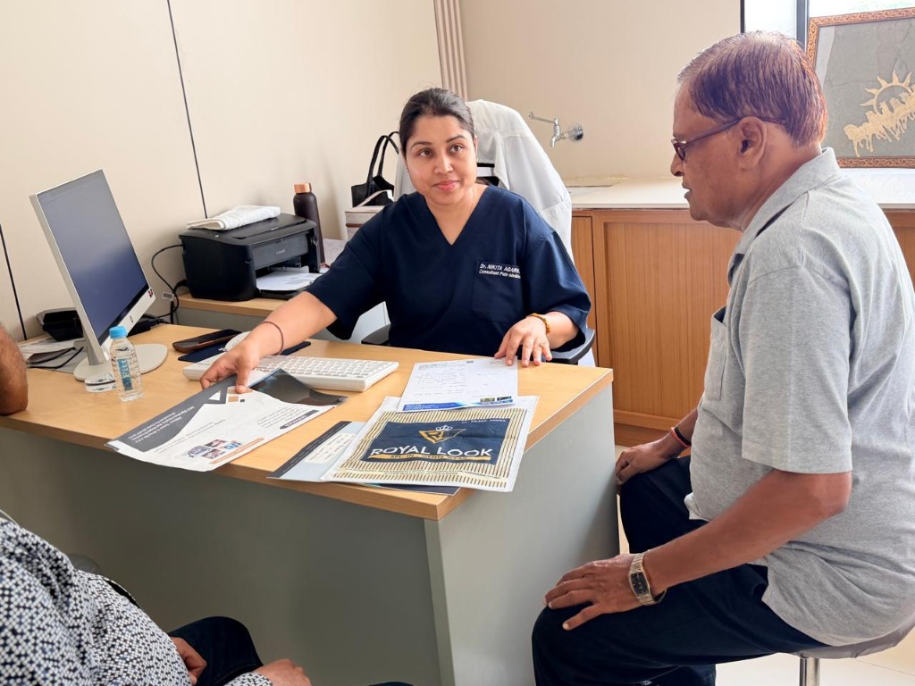 Dr. Nikita Varun Agarwal consulting a patient in her modern Lucknow clinic office