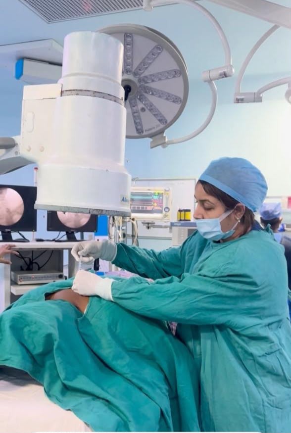 Dr. Nikita performing spine intervention under C-arm