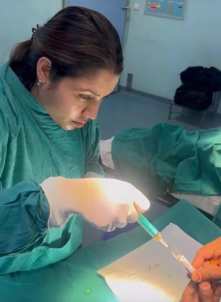 Dr. Nikita preparing syringe intervention